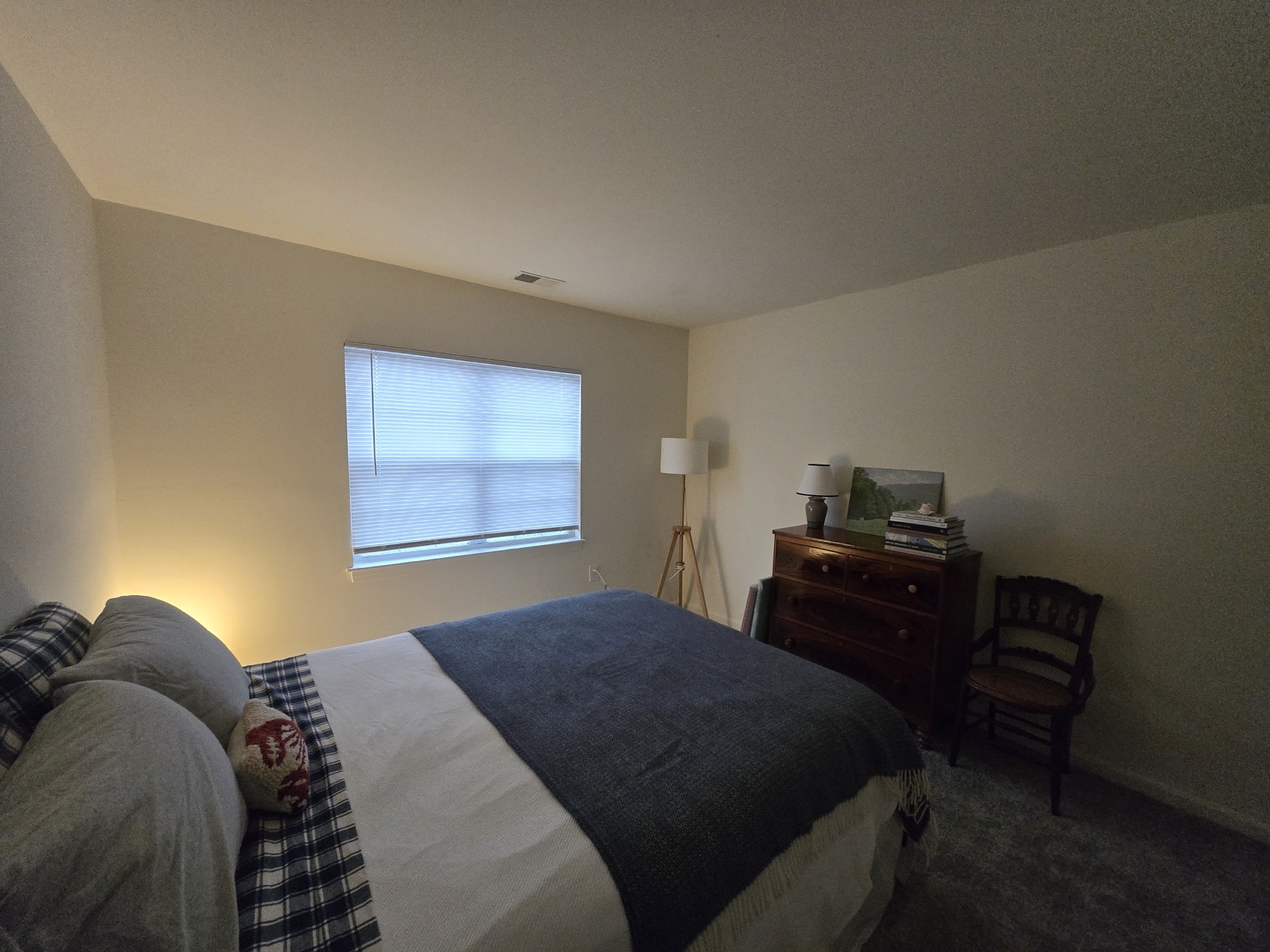 Window, floor lamp and antique dresser